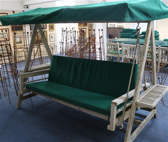 An Indian Ocean teak garden swing, W.270cm